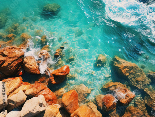 Swirling summer hues, Sky blue water kisses rocky shore, vibrant dance of nature's palette