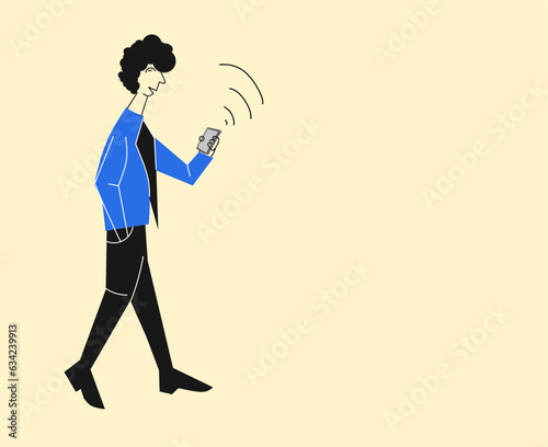 young man walking holding smartphone