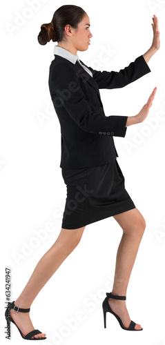 Digital png photo of asian businesswoman touching virtual interface on transparent background