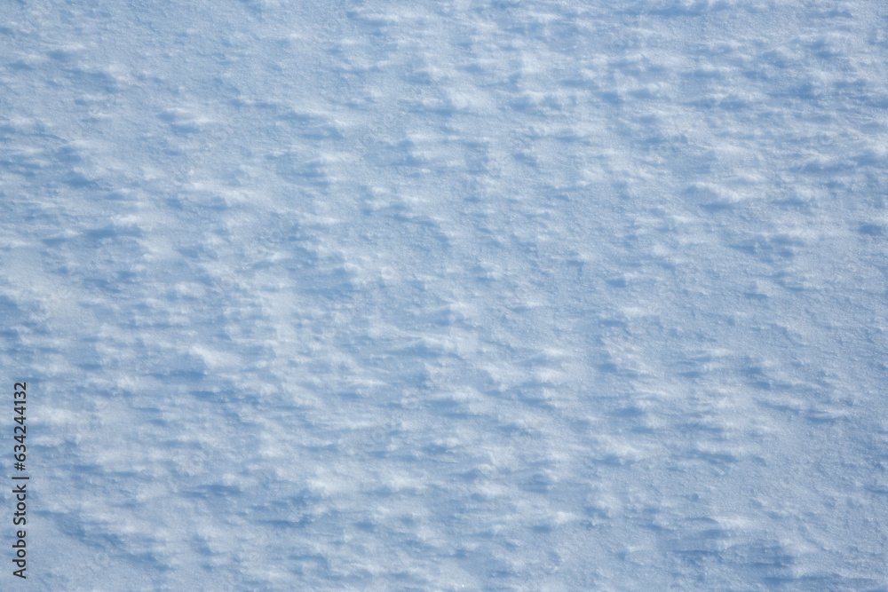 Natural snow texture. The surface of the snow crust. Snowy ground. Winter background with snow patterns. Perfect for Christmas and New Year design. Closeup top view. Natural snow texture. The surface of the snow crust. Snowy ground. Winter background with snow patterns. Perfect for Christmas and New Year design. Closeup top view.