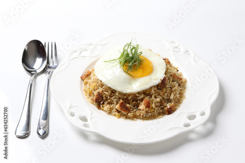 Japanese unagi fish seafood wok garlic fried rice with fried egg and vegetables in plate on vintage table cloth white background asian chef cuisine halal food menu for cafe