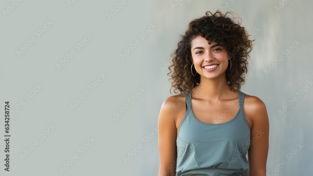 Curly Hair female wearing sportswear on pastel background Curly Hair female wearing sportswear on pastel background