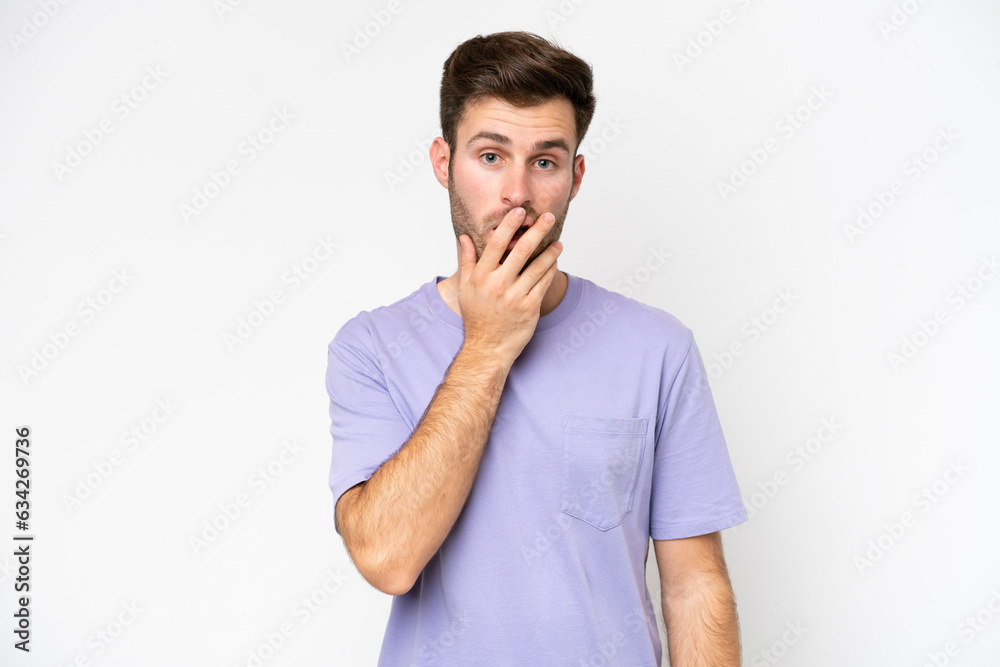 Young caucasian man isolated on white background surprised and shocked while looking right Young caucasian man isolated on white background surprised and shocked while looking right