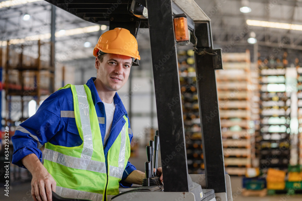 © Hip.hub - Industrial worker driving a forklift in the factory. The engineer is working and maintaining the warehouse. © Hip.hub - Industrial worker driving a forklift in the factory. The engineer is working and maintaining the warehouse.