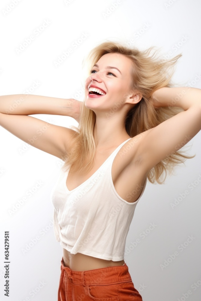 a beautiful young woman posing with her arms outstretched against a white background a beautiful young woman posing with her arms outstretched against a white background
