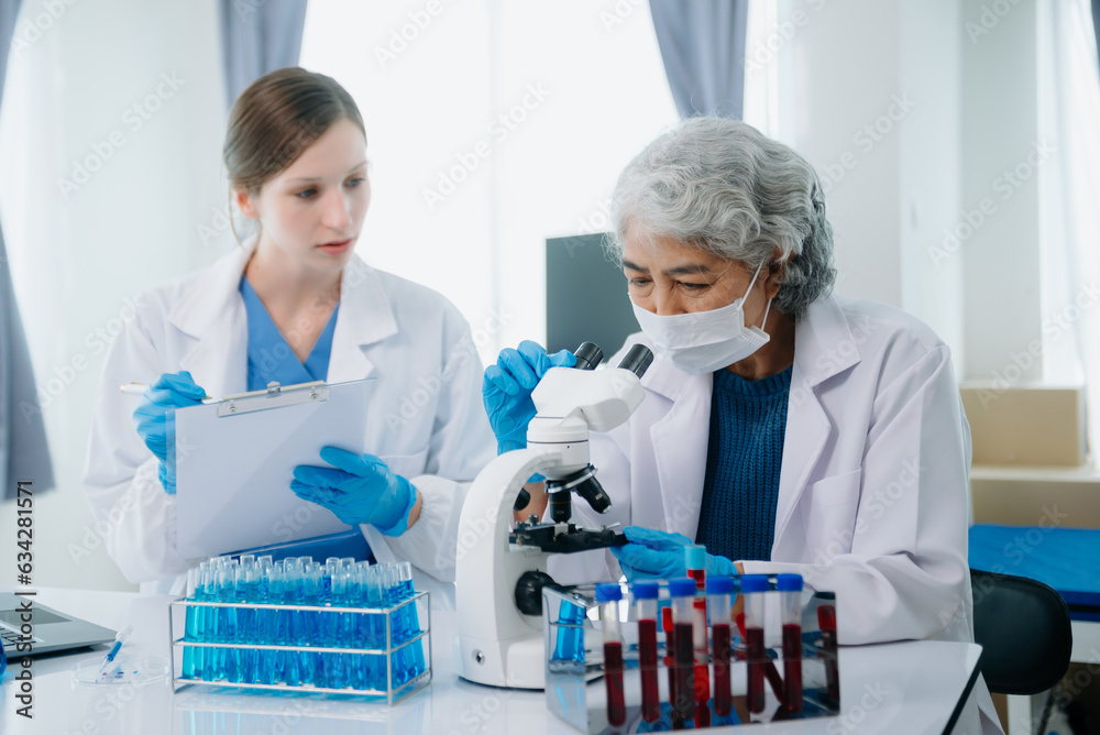 Medical team having a meeting with doctors. Young scientists conducting research investigations in a medical laboratory, a researcher. Medical team having a meeting with doctors. Young scientists conducting research investigations in a medical laboratory, a researcher.