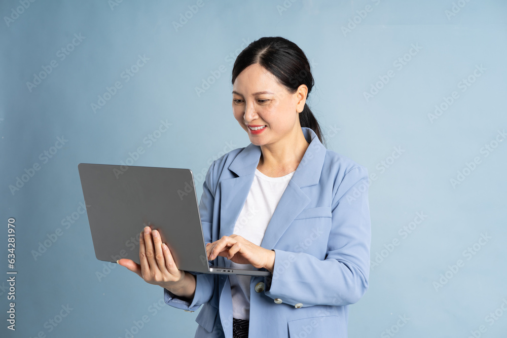 portrait of an elderly woman using a laptop portrait of an elderly woman using a laptop