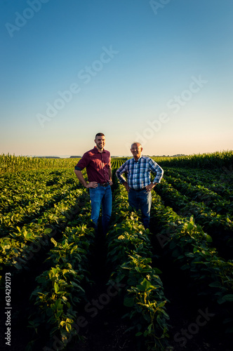 Portrait of two farmers standing in soy field looking at camera. © Zoran Zeremski