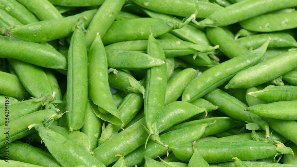 Fresh pea pods as background. Top view. Fresh pea pods as background. Top view.