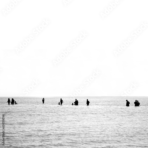 People walking in the middle of the Andaman see in the island of Ko Yao in southern Thailand.