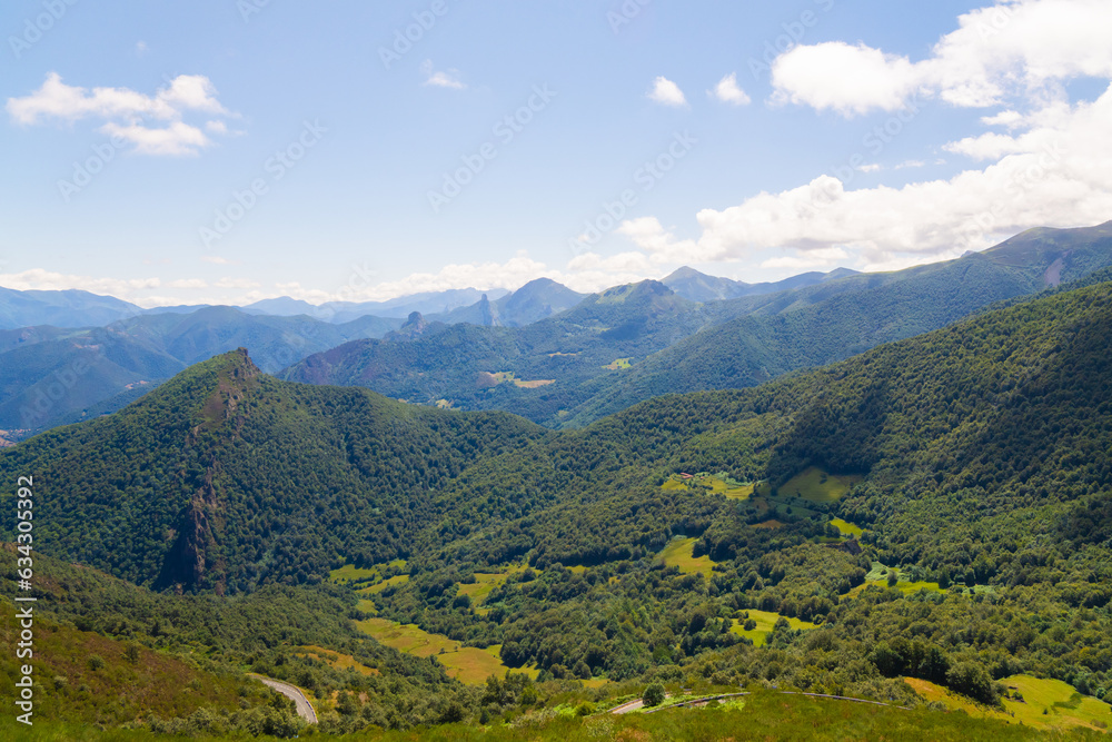 Tall Mountains, White Clouds, and Green Meadow: Beautiful Scenic View