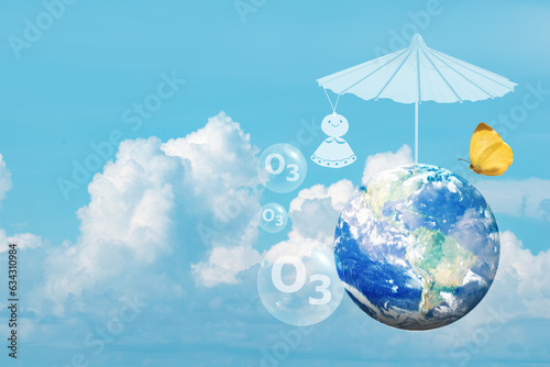 Earth,umbrella, old rain repellent doll and icon o3 on natural background.Elements of this image furnished by NASA. photo