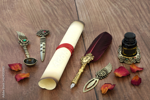 Parchment paper scroll with old feather quill pen, retro brass writing equipment and rose petals for love letter for Valentines Day on rustic wood.