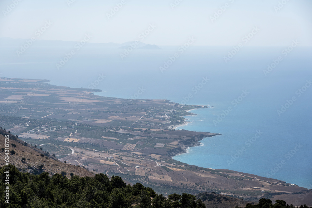 Panoramic view of the mountains of the Gorge and the Sea against the backdrop of the blue sky on the island of Crete Sunny Day