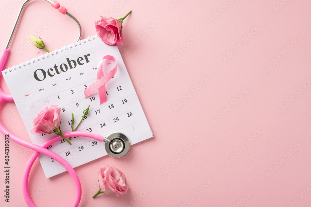 October's Pink Ribbon Campaign is here. Top view of calendar and pink ribbon, stethoscope and eustoma flowers on pastel pink isolated background, perfect for text or advertising placement October's Pink Ribbon Campaign is here. Top view of calendar and pink ribbon, stethoscope and eustoma flowers on pastel pink isolated background, perfect for text or advertising placement