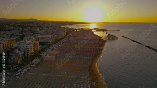 Italy, August 2023: aerial sea view of the sunset on the Romagna Riviera from Gabicce, Cattolica, Misano, Riccione to Rimini photo