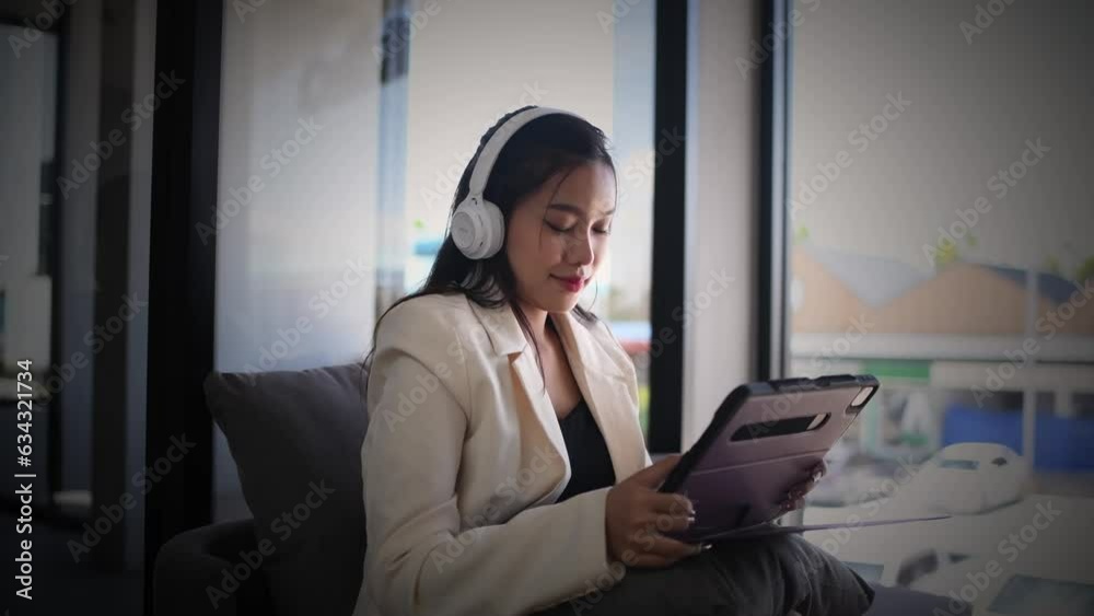 Portrait happy woman at coffee corner with a cup of coffee listen music from Bluetooth earphone is business relaxing concept. Portrait happy woman at coffee corner with a cup of coffee listen music from Bluetooth earphone is business relaxing concept.