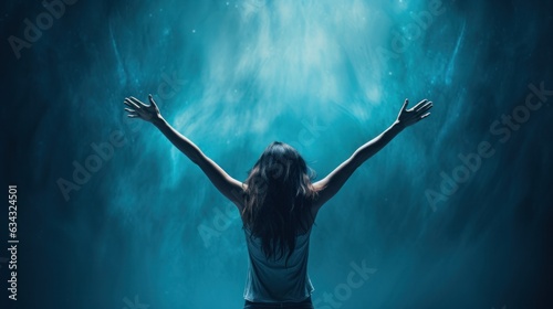 At a concert, a woman with her arms raised in the air dances with wild abandon, as if the music were carrying her through an underwater dreamscape