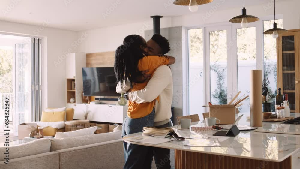 A Black Couple Hugging Each Other in The Kitchen After a Fight A Black Couple Hugging Each Other in The Kitchen After a Fight