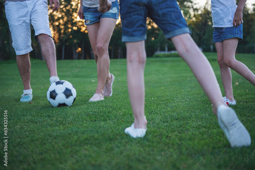 Family playing soccer Family playing soccer