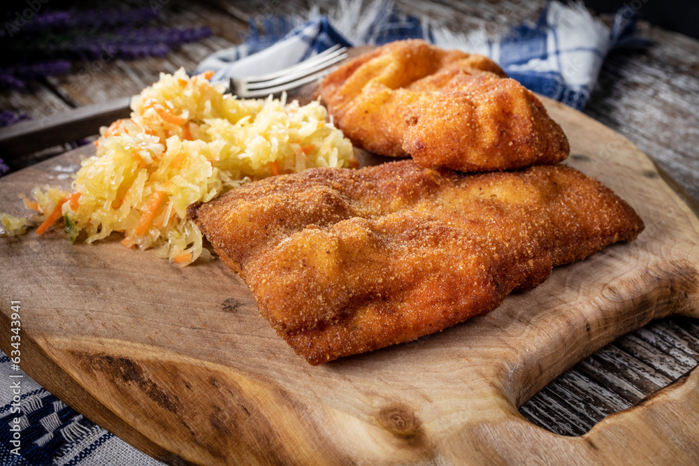 Two fried cod fillet pieces.