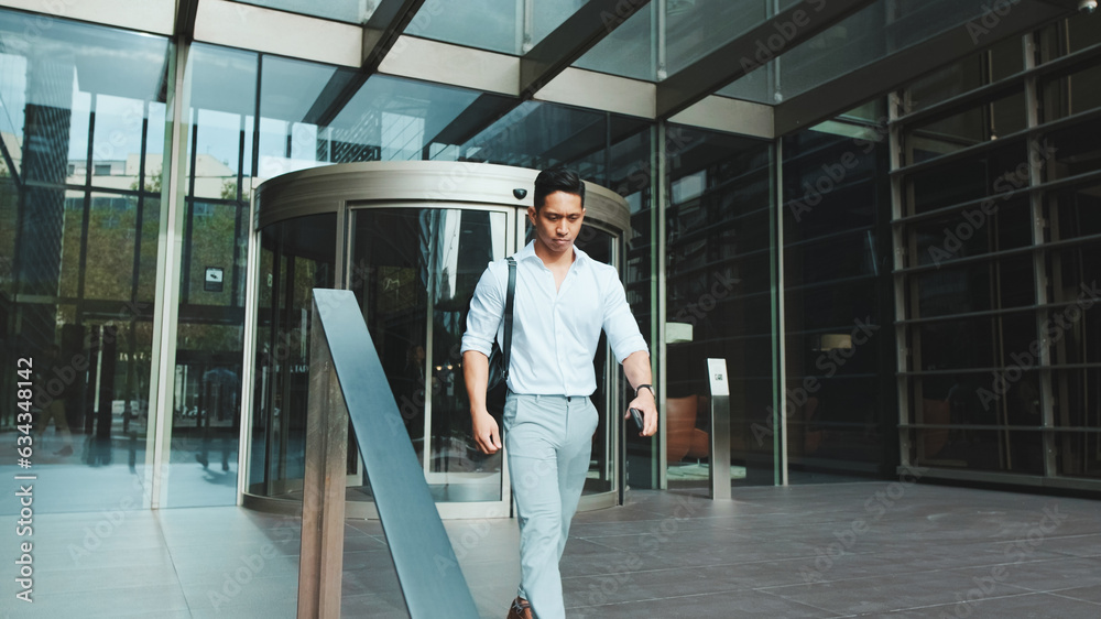 Young businessman leaving the business center Young businessman leaving the business center