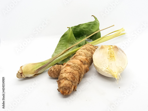bay leaf, lemongrass, garlic and kencur on a white background