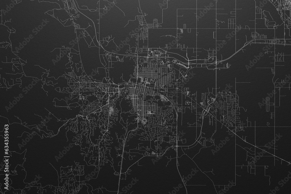 Street map of Rapid City (South Dakota, USA) on black paper with light coming from top