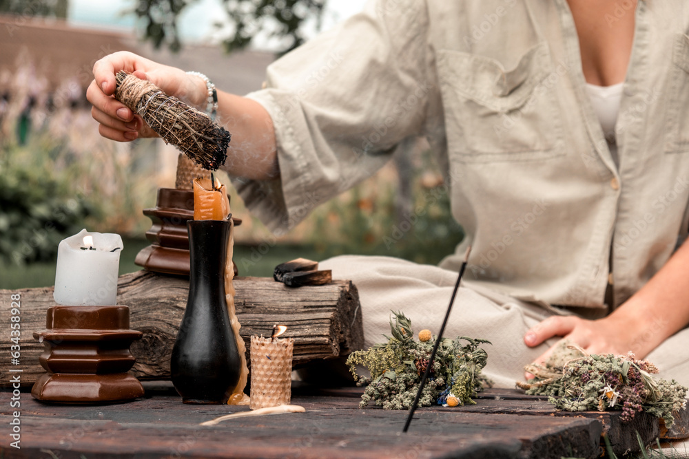 Woman Inhaling Incense Smoke During Meditation.Ground level of relaxed