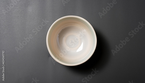 Ceramic bowl on black background  top view