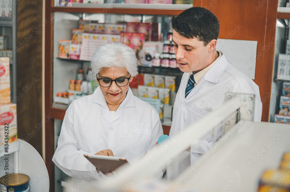 skilled pharmacist is consulting, analyzing the use of drugs to recommend and supervise patients according to prescriptions in modern pharmacies. skilled pharmacist is consulting, analyzing the use of drugs to recommend and supervise patients according to prescriptions in modern pharmacies.