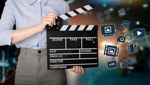 Woman holding Clapperboard or movie slate use in video production ,film, cinema industry.