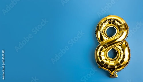 Banner with number 8 golden balloon with copy space. Eight years anniversary celebration concept on a blue background.