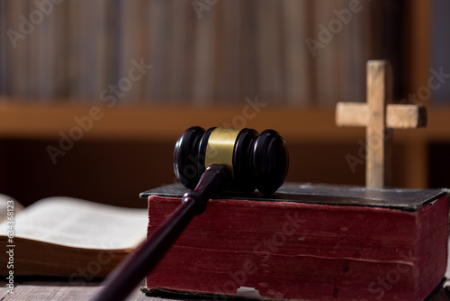 Holy bible book and judge's gavel on table background. Judicial system, constitution, democracy, rule of law. There are no people in the photo. There is free space to insert.