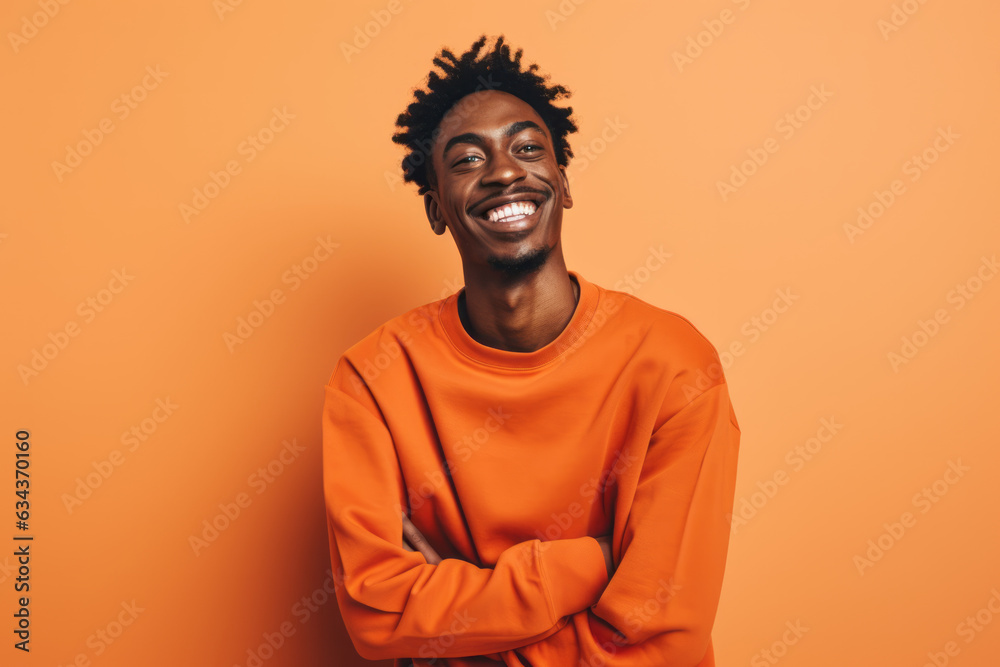 Smiling African American Man with Vibrant Orange Studio Background Smiling African American Man with Vibrant Orange Studio Background