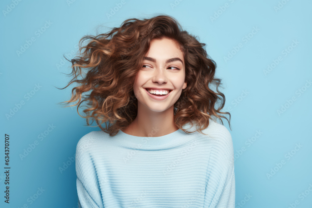 Joyful Caucasian Woman with Radiant Smile on Vibrant Blue Studio Background Joyful Caucasian Woman with Radiant Smile on Vibrant Blue Studio Background