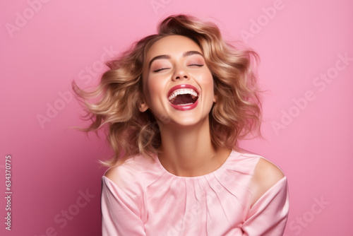 Joyful Caucasian Woman with a Radiant Smile on Vibrant Pink Studio Background