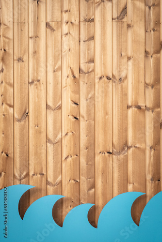 Wooden texture background with blue waves made of cardboard. Summer beach cafe or bar wall decoration. Surfing spot creative design. Ocean, seafood restaurant, seasonal decor concept. Space, vertical 