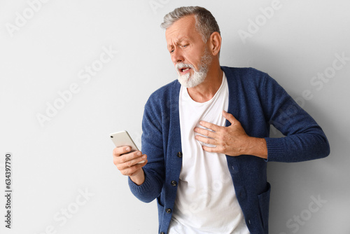 Mature man with heart attac...