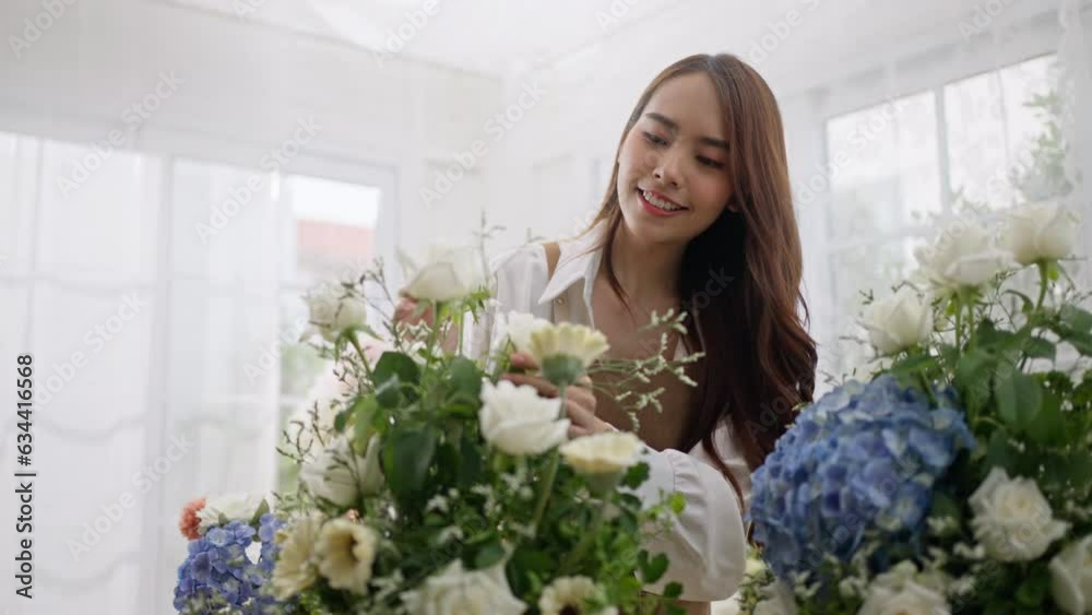 Small business,business online and New market concept.Young florist female use smartphone take photo bouquet of flower send to customer at workplace.woman artist working in flower shop studio at home Small business,business online and New market concept.Young florist female use smartphone take photo bouquet of flower send to customer at workplace.woman artist working in flower shop studio at home