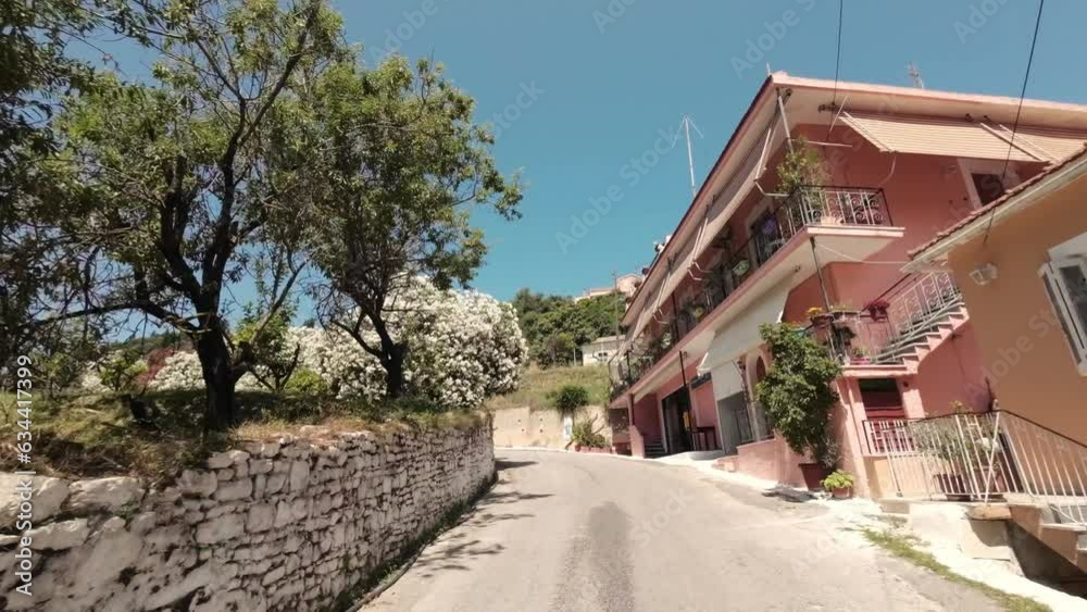 Enjoyable sunny holiday drive through a charming village on Corfu Island Enjoyable sunny holiday drive through a charming village on Corfu Island
