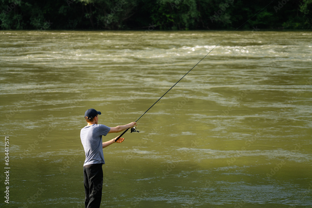 Man fishing on the mountain river Man fishing on the mountain river