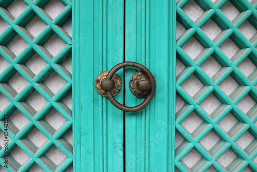 old blue wooden door with handle