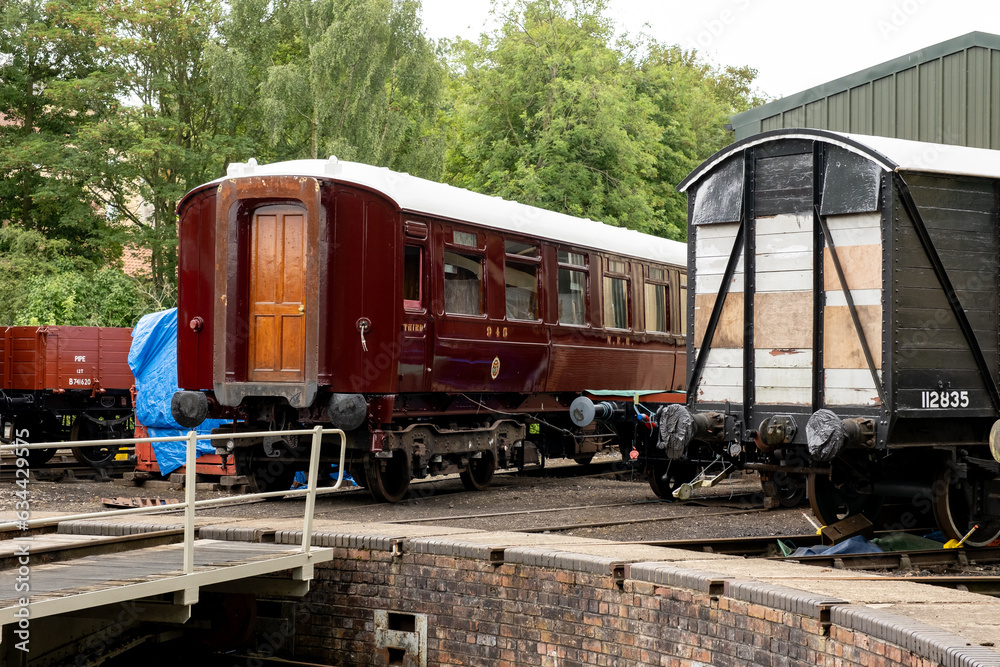 Traditional passenger carriages in a railway shunting yard