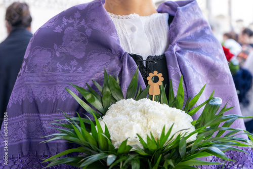  Zaragoza Spain. October 12, 2022 close up picture of the flowers offering by a young girl to the Virgin of Pilar on the national day of Spain