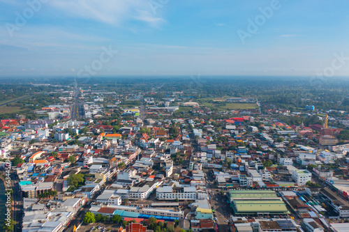 Aerial view of residential neighborhood roofs. Urban housing development from above. Top view. Real estate in Roi et province city, Thailand. Property real estate.