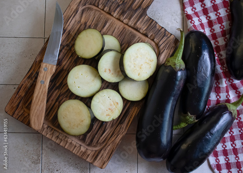 Fresh eggplant on old background photo