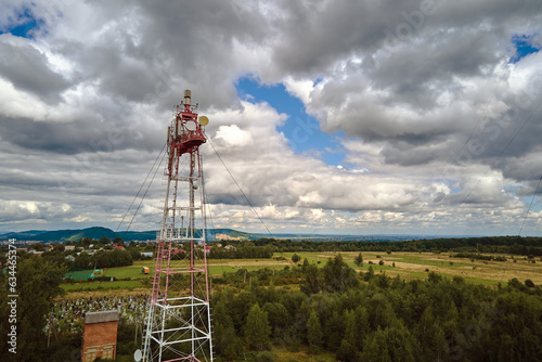 Aerial view of telecommunications cell phone tower with wireless communication antennas for network signal transmission