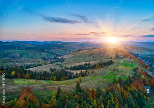 Sunset over the mountains in the Carpathians. Aerial drone view.