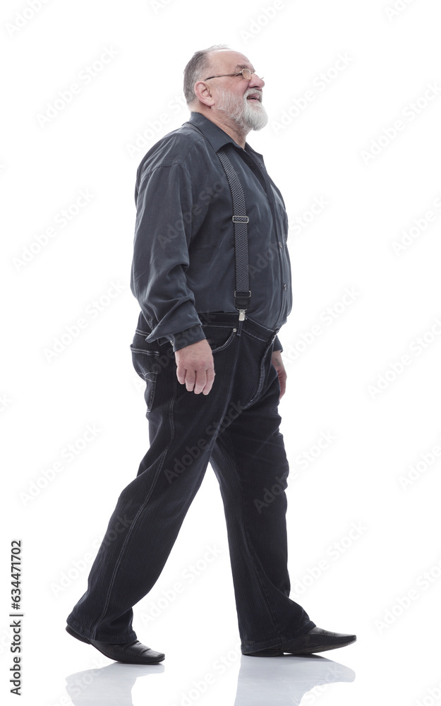 in full growth. happy bearded man striding forward. in full growth. happy bearded man striding forward.